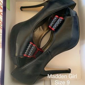 Black heel with very cute white/red/black polka dots.